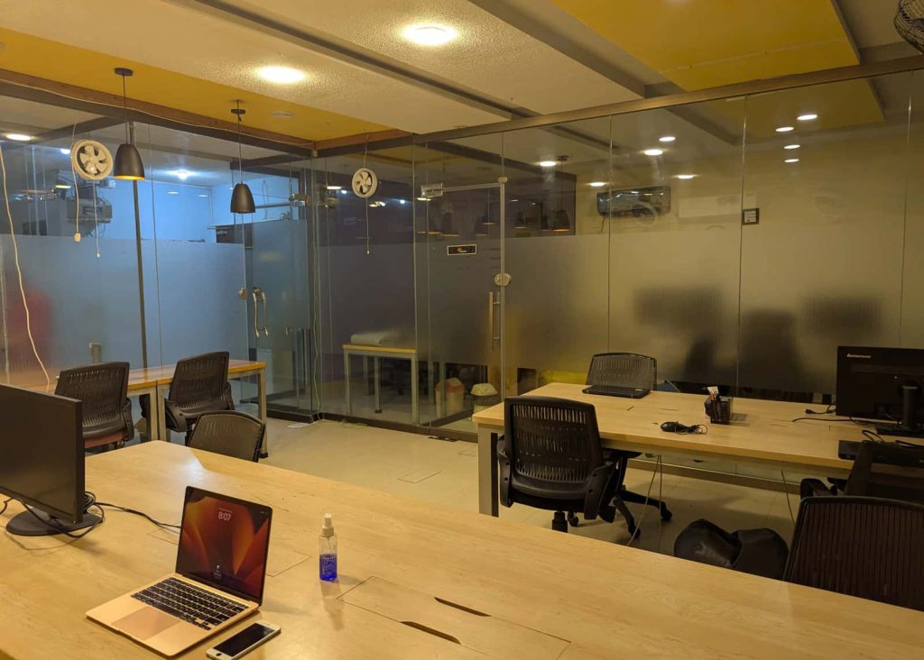 Hall 1 shared workspace, fourteen seats on the first floor at Desk&Wifi Coworking, Bahria Town, Lahore