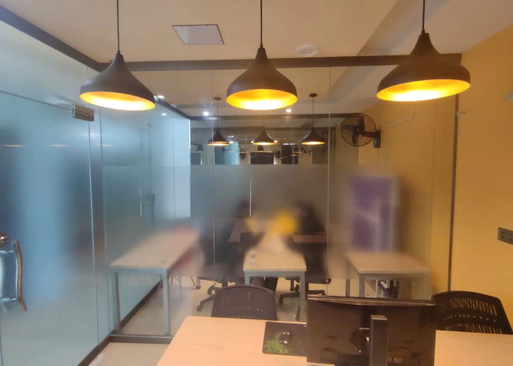 The conference room, bookable by the hour at Desk&Wifi Coworking, Bahria Town, Lahore