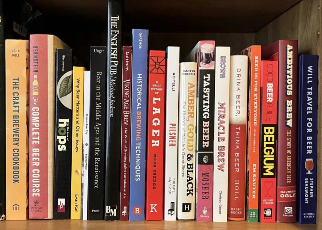 The library shelves members borrow from at Desk&Wifi Coworking, Bahria Town, Lahore